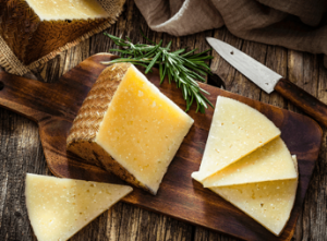 Manchego cheese on a cutting board