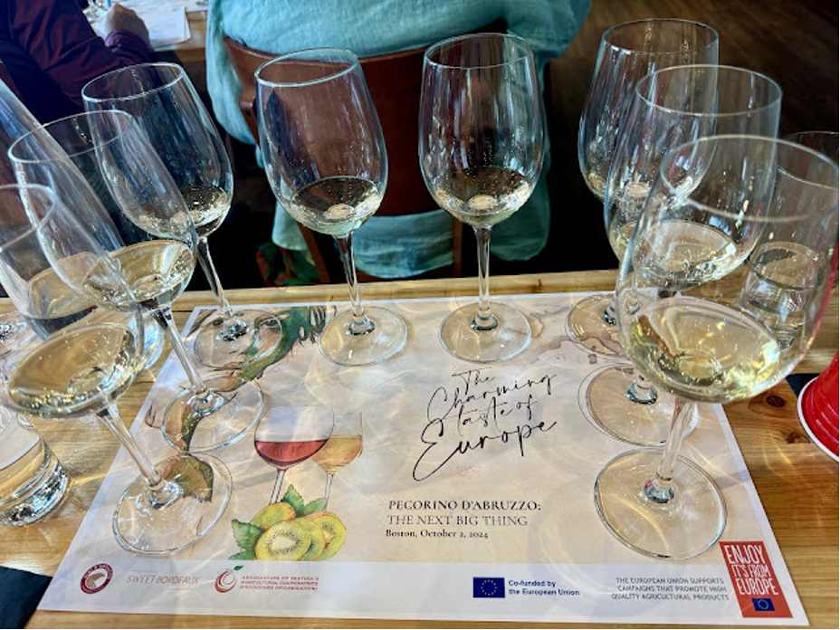 Vernaccia wine glasses on a table.