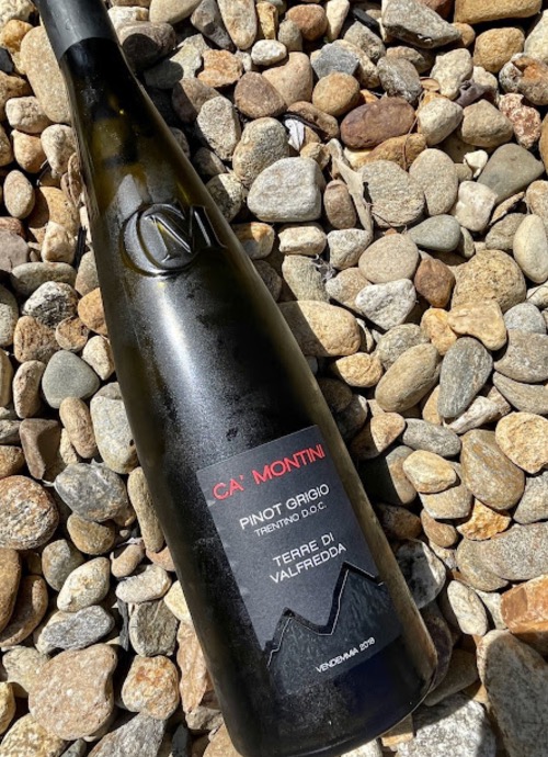 wine bottle on pebbles